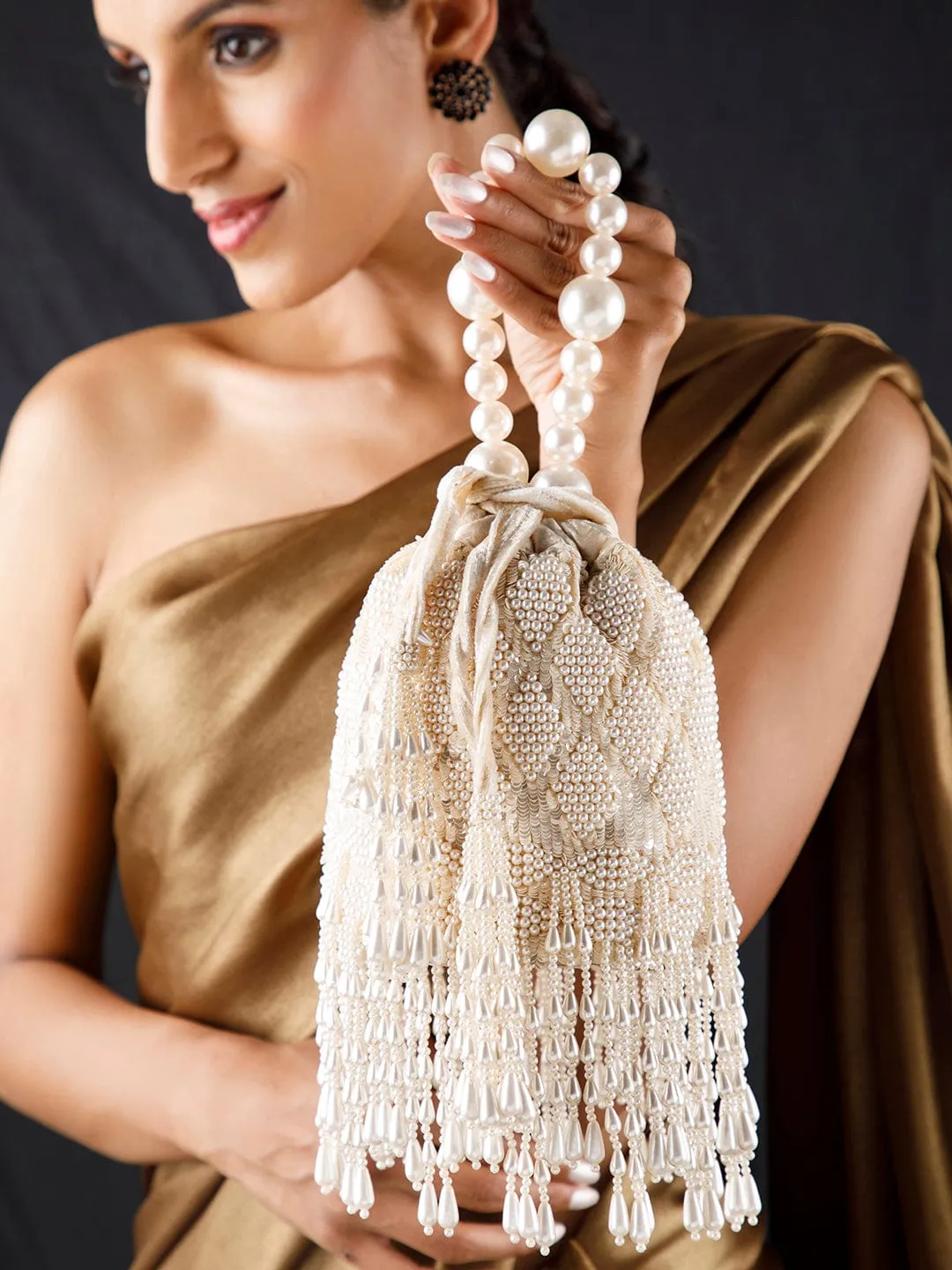 Rubans Off White Coloured Potli Bag With Embroided Design And Pearls.