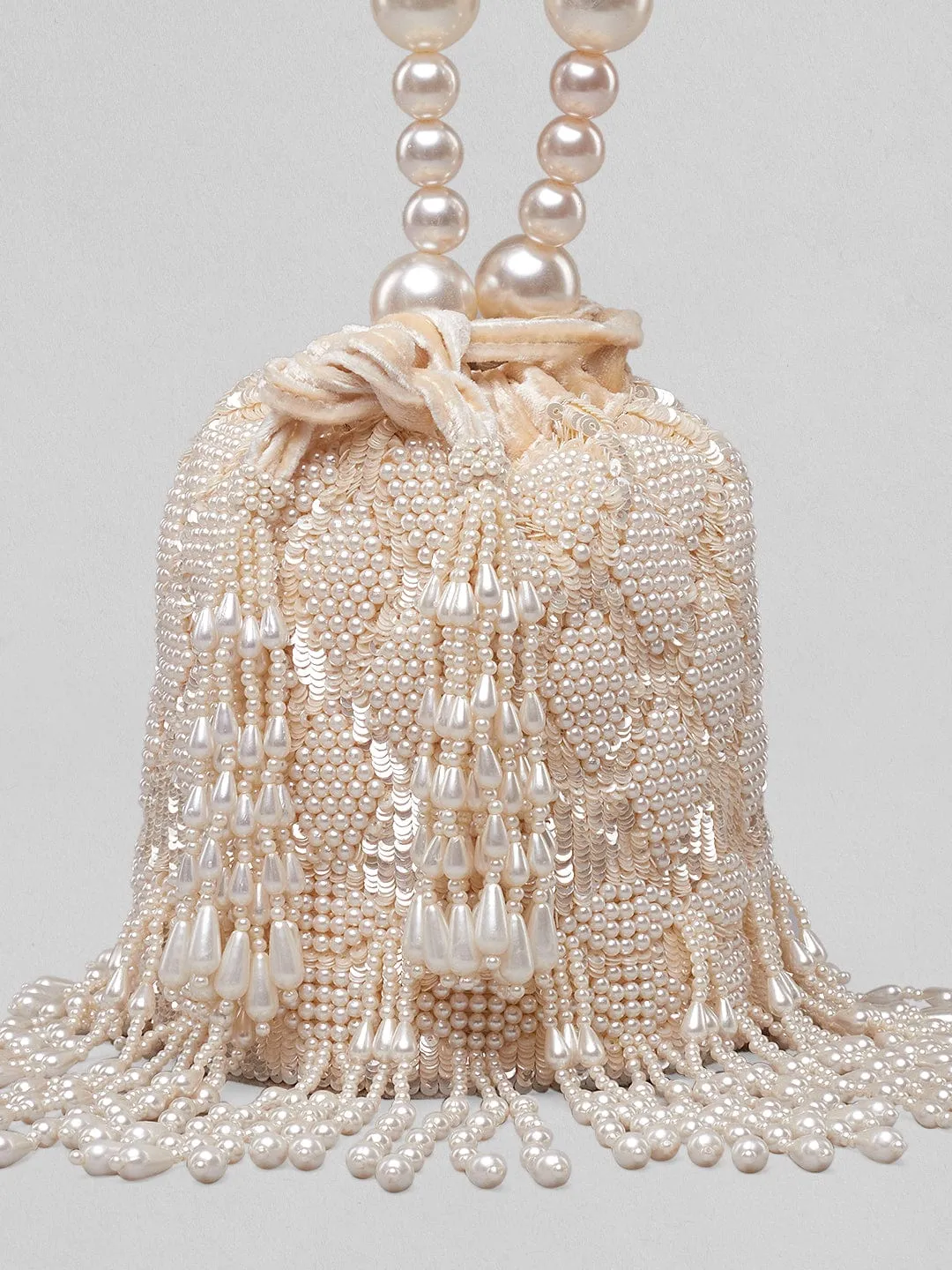 Rubans Off White Coloured Potli Bag With Embroided Design And Pearls.